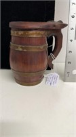 Early handmade wooden beer tankard with copper