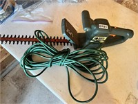 Black and Decker hege trimmer with cord.