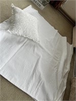 White blanket and pillow (There is a stain on the