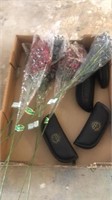 fake flowers and eyeglass cases