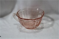 A Pink Depression Glass Cup