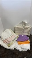 (2) packages of hangers, large box of linens