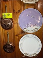 Assorted decorative plates, pans all hanging