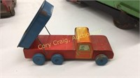 Vintage wood and metal toy delivery truck.