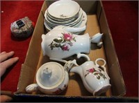 Vintage rose tea related dishes.