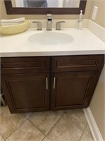 Sink and Cabinet in Mens Bathroom