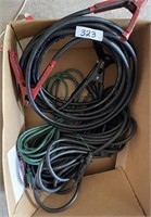 Box with jumper cables and extension cords