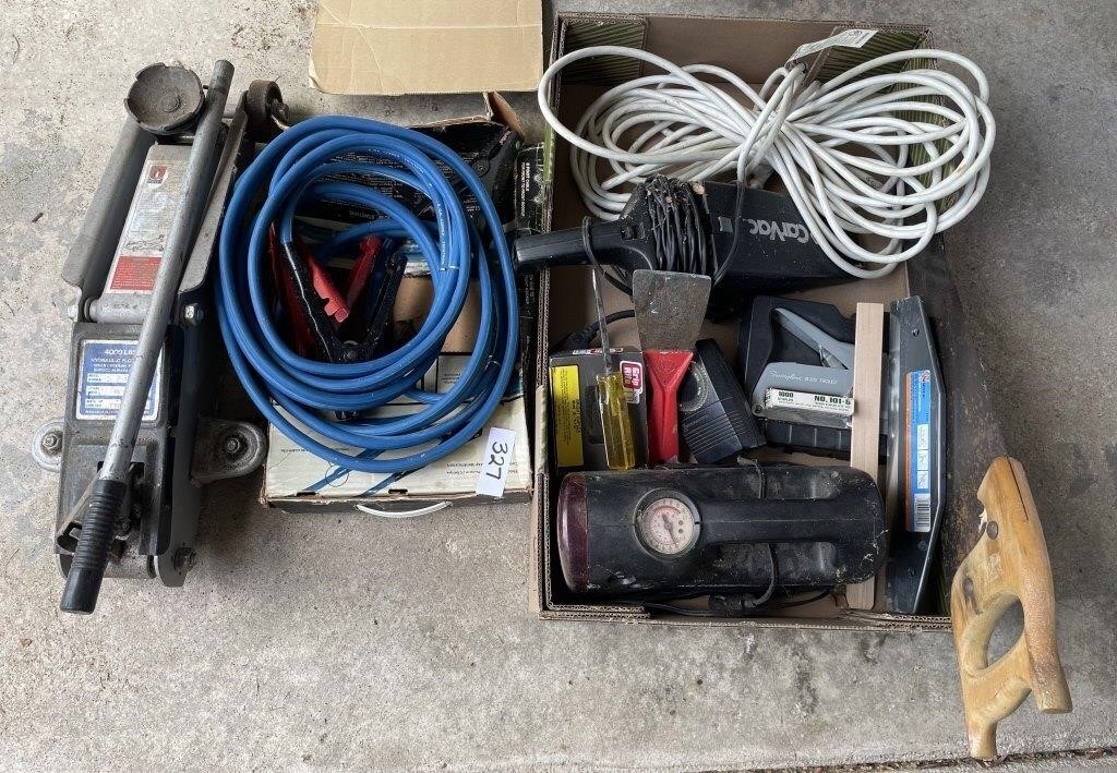 Group with heavy duty jumper cables, tools,