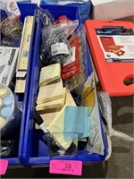 blue Fastenal bin filled with office supplies