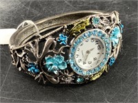 Bedazzled ladies wrist watch with hinged cuff styl
