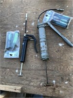 Two Grease Guns & Package of Small Grease