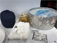 Navy hat, dried flowers and pillow in hat box