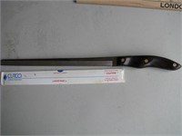 Cutco knife w/ Walnut handle, surrated edge