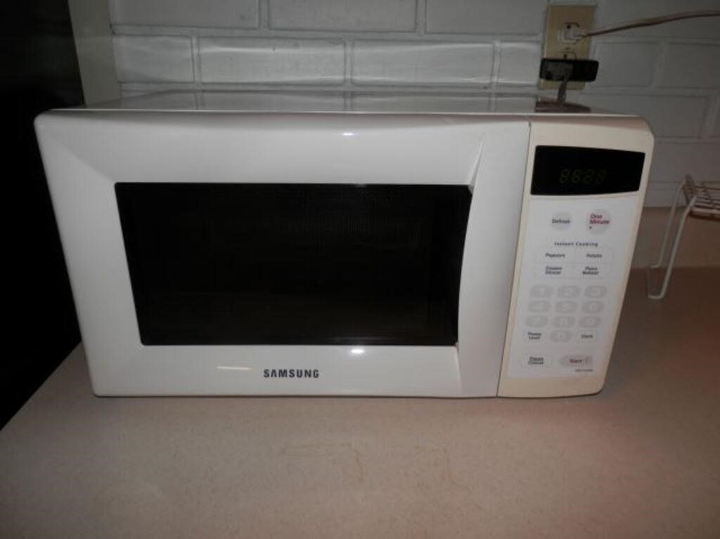 White Samsung microwave 10 x 19 1/2" W x 13 1/2 D