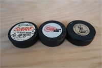 3 Hockey Pucks; 1 with many Autographs