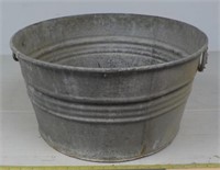 Large aluminum pot with handles.