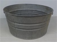 Large aluminum pot with handles.