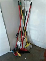 Brooms and mops in bucket