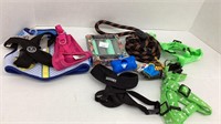 Assorted pet harnesses, leash, and sanitary bags