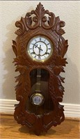 Mechanical Wall Clock in Ornate Carved Case