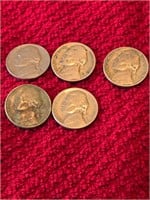 Three rolls of wheat pennies and nickels