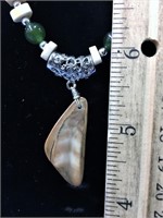 16" jade and ivory necklace with a fossilized ivor