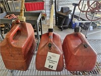 3 various sized plastic gas cans
