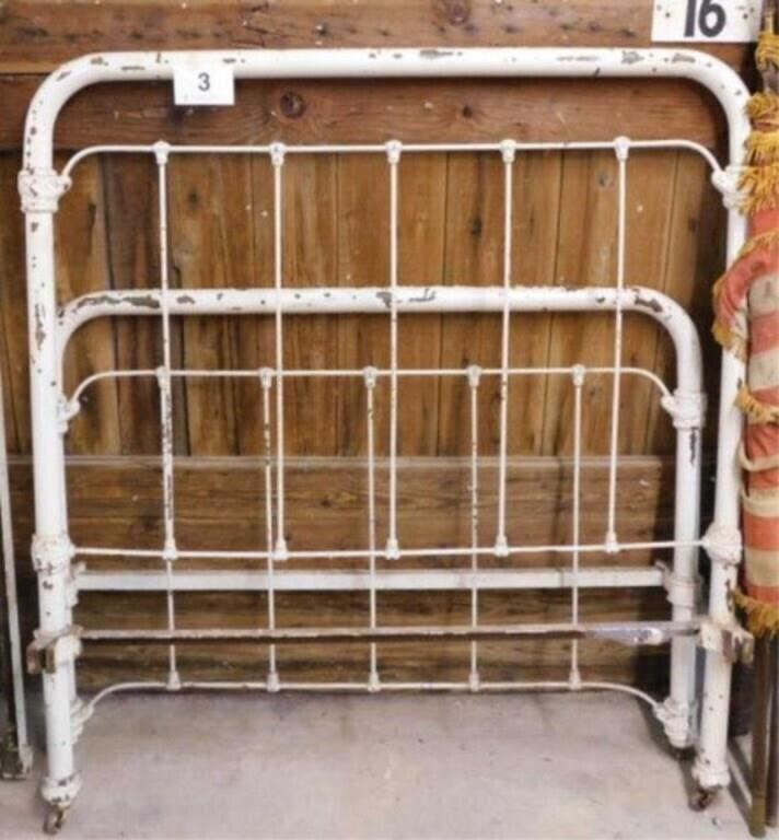 Antique cast iron full size bed on casters