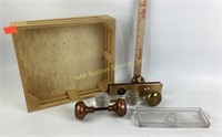 Brass doorknobs (2).  Cut glass knife rest.  Cut