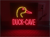 Light up sign, says with a duck says  "Duck Cave"