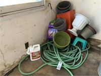 Garden Hose and Many Flower Pots