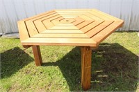 Wood patio table, 57" diameter X 27"H, has