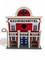 Red bird hotel wooden birdhouse 
9” h.