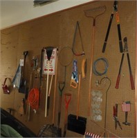Lot #698 - Qty of tools on pegboard: shovels,