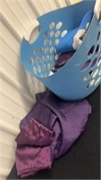 Laundry basket with linens