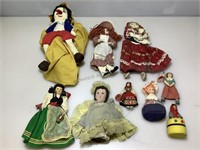 Assorted collectible dolls.