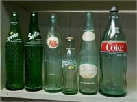 Sprite, RC cola, coke and Dr pepper bottles all