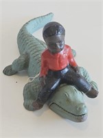 VTG CAST IRON BLACK AMERICANO BOY RIDING AN ALLIGA