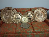 6 brass wall hanging plates. Largest is approx 24