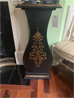 Black plant stand with gold design