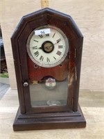 Antique mantle clock with key and pendulum