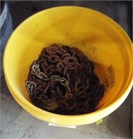 5 Gallon bucket full of various size tow chain.