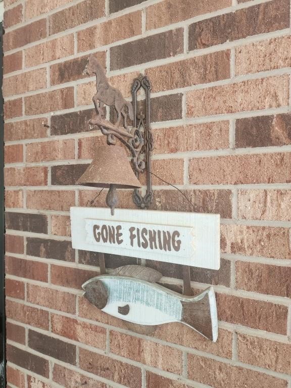 Horse bell rusty and gone fishing sign