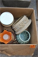 box of candleholders and candles