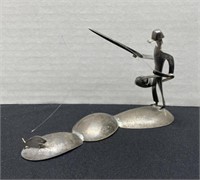 Metal Figurine 
Fisherman on Spoons