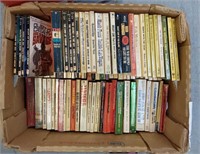 BOX OF PAPERBACK BOOKS STACKED