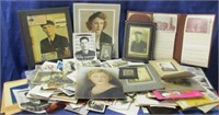 collection of old pictures in blue tote