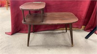 Small wooden side/end table. Measures 15x22x27.75