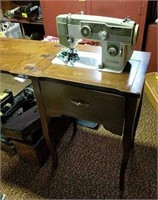 White Sewing Machine in Cabinet