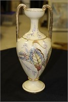 Tan Double Handled Vase Decorated With Leaves